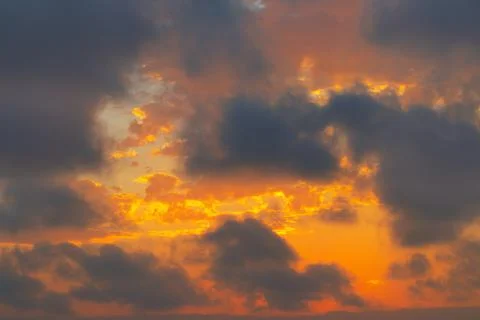 Beautiful vibrant sunset with dramatic clouds Stock Photos