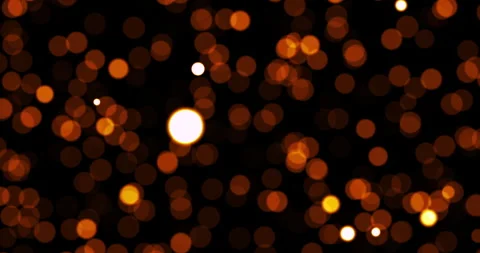 A beautiful video loop displays warm golden bokeh elements cascading down in 스톡 동영상 336852350