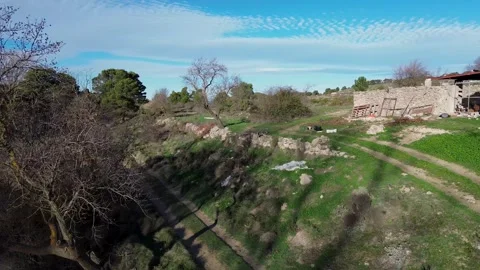A beautiful video shot on a quadcopter, a view from above of green fields and an Stock Footage 311872885