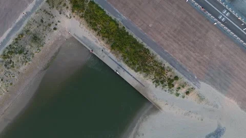 Beautiful view from above to the dam between the river and the North Sea. Video stock 255796233