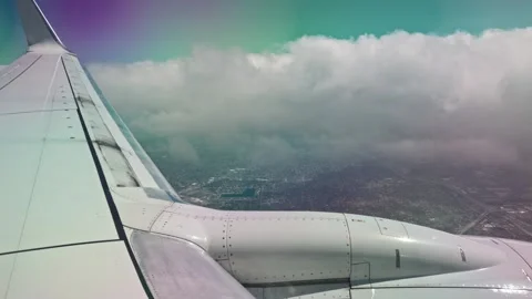 Beautiful view of airplane descending through clouds during landing approach Stock Footage 345317412
