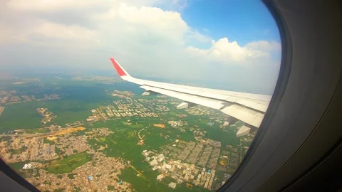 Beautiful view of airplane window overlooking city of India Stock Footage 293403065