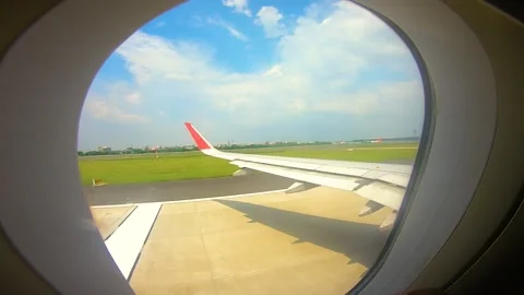 Beautiful view of airplane window overlooking city of India Stock Footage 293405926