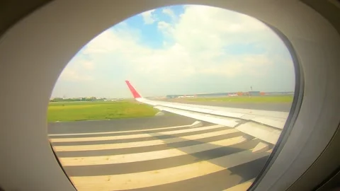 Beautiful view of airplane window overlooking city of India Stock Footage 293405951