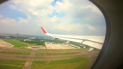 Beautiful view of airplane window overlooking city of India Stock Footage 293406008