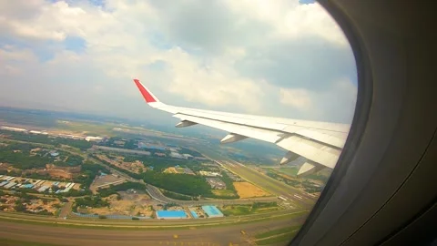 Beautiful view of airplane window overlooking city of India Stock Footage 293406031