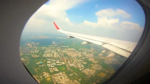 Beautiful view of airplane window overlooking city of India Stock Footage 293406113
