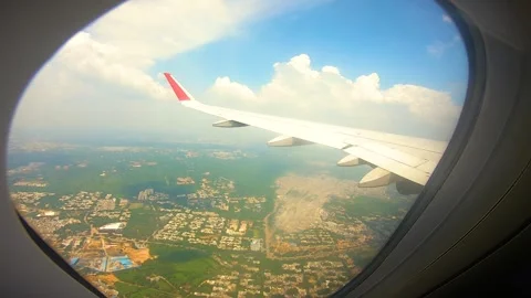 Beautiful view of airplane window overlooking city of India Stock Footage 293406125