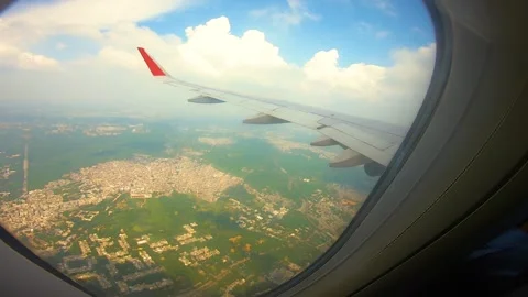 Beautiful view of airplane window overlooking city of India Stock Footage 293406153