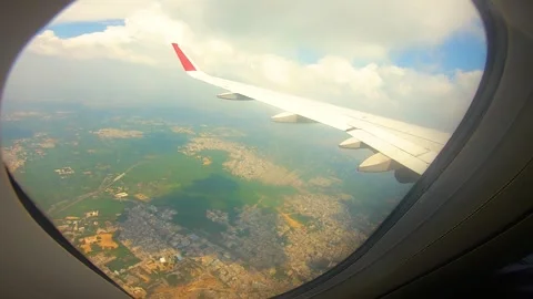 Beautiful view of airplane window overlooking city of India Stock Footage 293406161