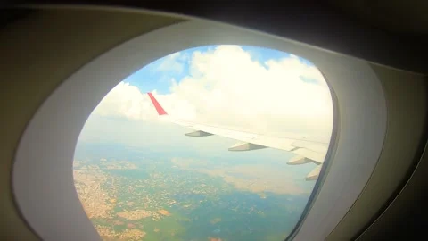 Beautiful view of airplane window overlooking city of India Stock Footage 293406223