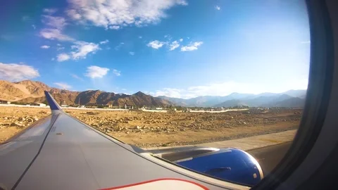 Beautiful view of airplane window overlooking city of India Stock Footage 293406439
