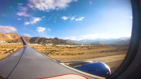 Beautiful view of airplane window overlooking city of India Stock Footage 293406513