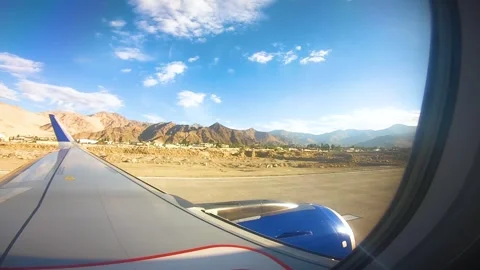 Beautiful view of airplane window overlooking city of India Stock Footage 293406562