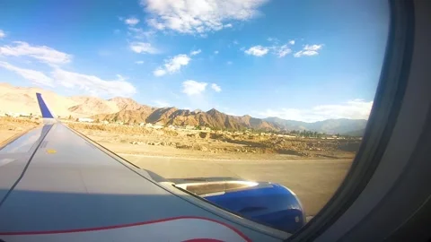 Beautiful view of airplane window overlooking city of India Stock Footage 293406567