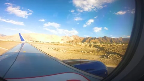 Beautiful view of airplane window overlooking city of India Stock Footage 293407093