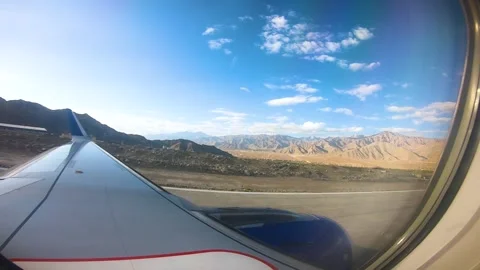 Beautiful view of airplane window overlooking city of India Stock Footage 293407683