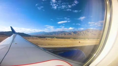 Beautiful view of airplane window overlooking city of India Stock Footage 293408038