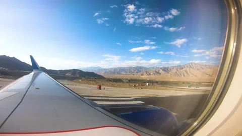 Beautiful view of airplane window overlooking city of India Stock Footage 293408177