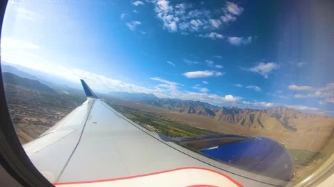Beautiful view of airplane window overlooking city of India Stock Footage 293408178