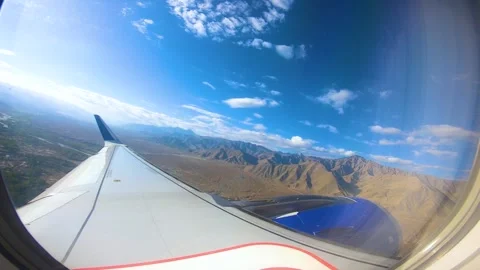 Beautiful view of airplane window overlooking city of India Stock Footage 293408245