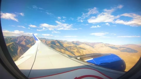 Beautiful view of airplane window overlooking city of India Stock Footage 293408683