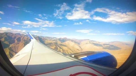 Beautiful view of airplane window overlooking city of India Stock Footage 293409029