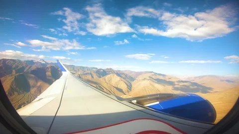 Beautiful view of airplane window overlooking city of India Stock Footage 293409261