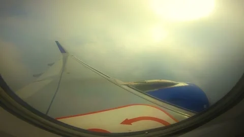 Beautiful view of airplane window overlooking city of India Stock Footage 293411131