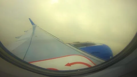 Beautiful view of airplane window overlooking city of India Stock Footage 293411132