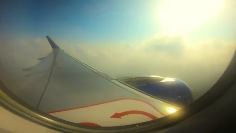 Beautiful view of airplane window overlooking city of India Stock Footage 293411136