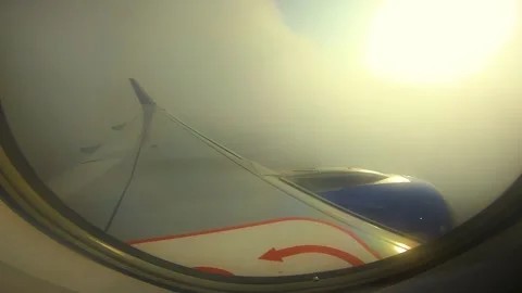 Beautiful view of airplane window overlooking city of India Stock Footage 293411190
