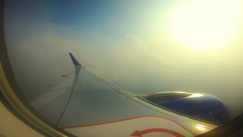 Beautiful view of airplane window overlooking city of India Stock Footage 293411204