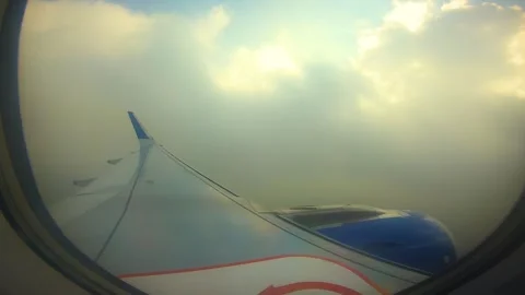 Beautiful view of airplane window overlooking city of India Stock Footage 293411216