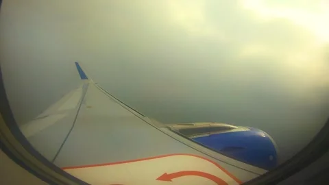 Beautiful view of airplane window overlooking city of India Stock Footage 293411266