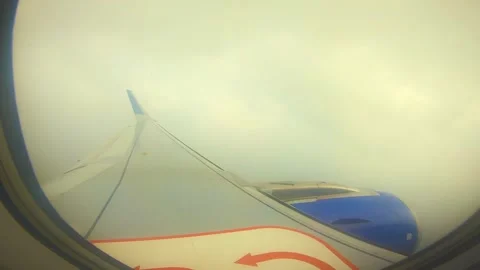 Beautiful view of airplane window overlooking city of India Stock Footage 293411283