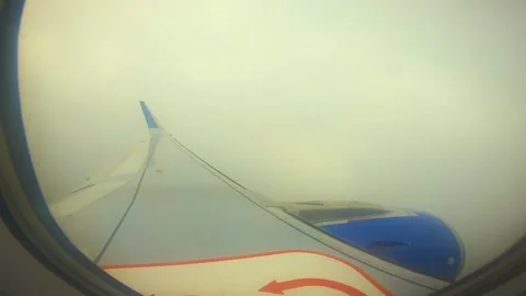 Beautiful view of airplane window overlooking city of India Stock Footage 293411319