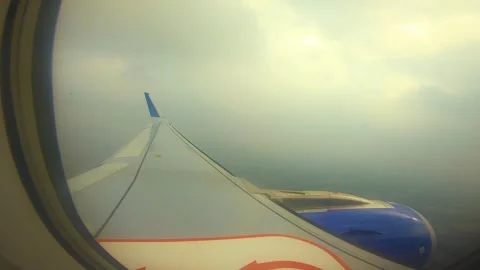 Beautiful view of airplane window overlooking city of India Stock Footage 293411338