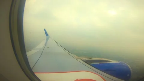 Beautiful view of airplane window overlooking city of India Stock Footage 293411389