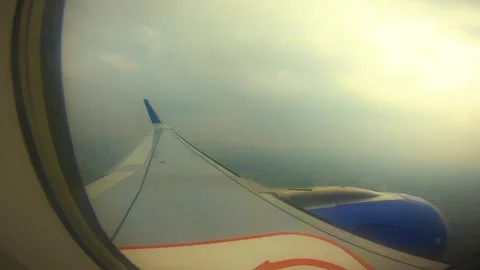 Beautiful view of airplane window overlooking city of India Stock Footage 293411414