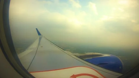 Beautiful view of airplane window overlooking city of India Stock Footage 293411421