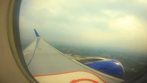 Beautiful view of airplane window overlooking city of India Stock Footage 293411425