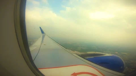 Beautiful view of airplane window overlooking city of India Stock Footage 293411427