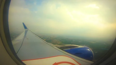 Beautiful view of airplane window overlooking city of India Stock Footage 293411462