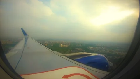 Beautiful view of airplane window overlooking city of India Stock Footage 293411492
