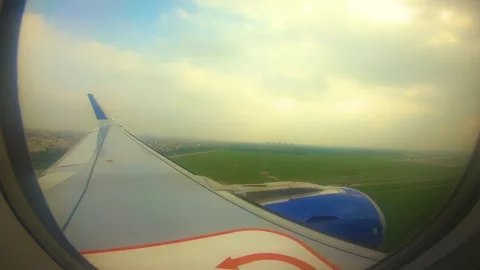 Beautiful view of airplane window overlooking city of India Stock Footage 293411499