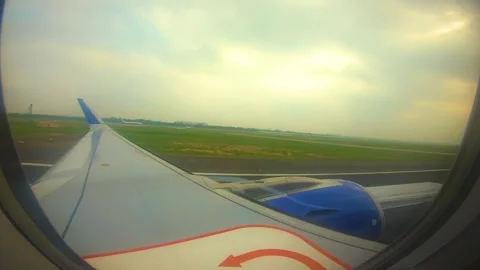 Beautiful view of airplane window overlooking city of India Stock Footage 293411506