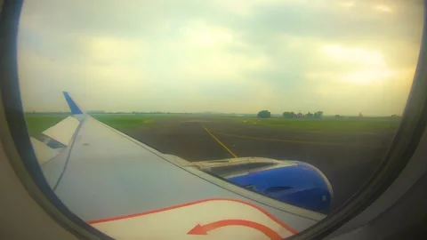 Beautiful view of airplane window overlooking city of India Stock Footage 293411535