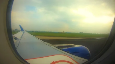 Beautiful view of airplane window overlooking city of India Stock Footage 293411564