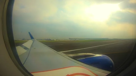 Beautiful view of airplane window overlooking city of India Stock Footage 293411579